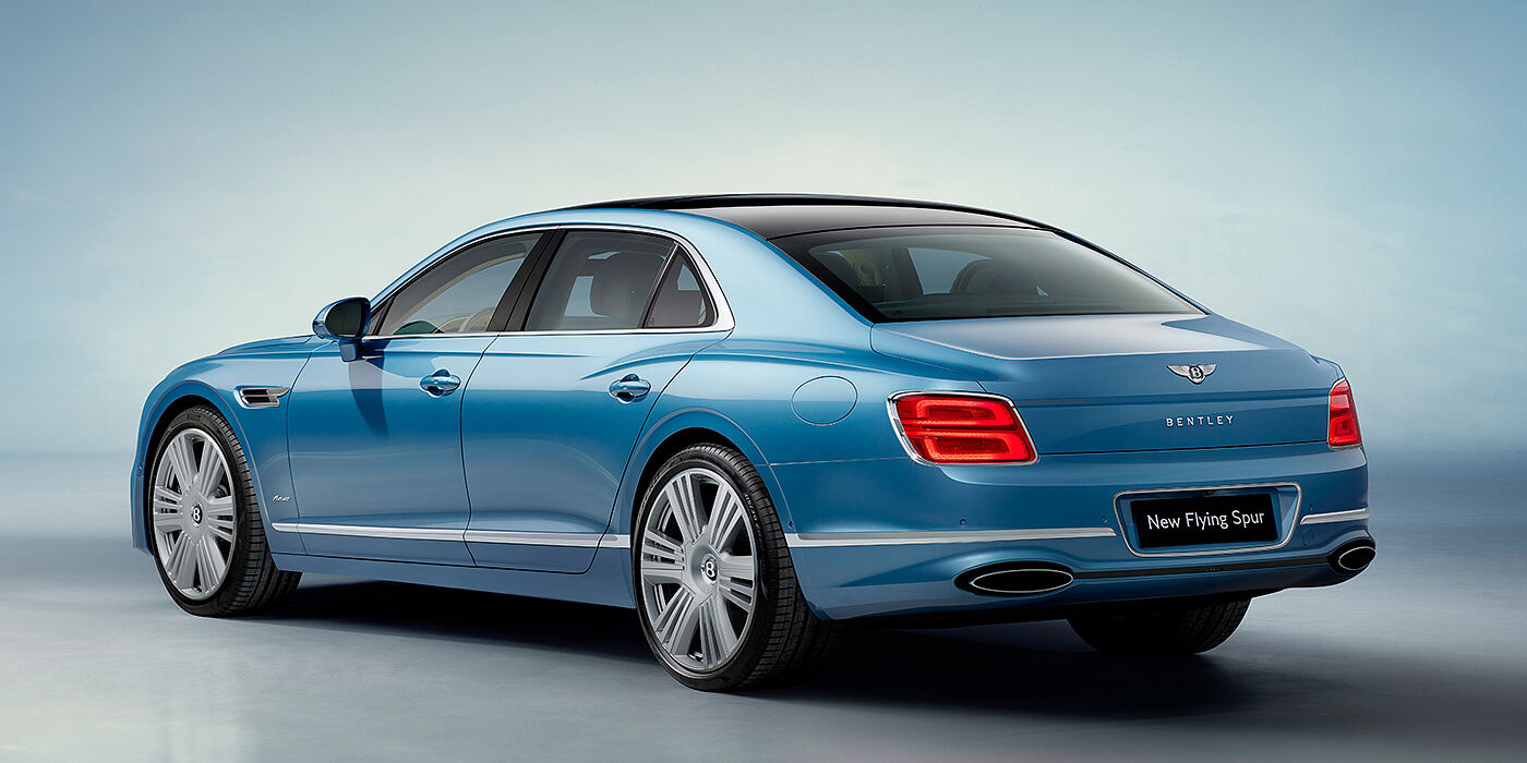 Bentley Tbilisi New Bentley Flying Spur Azure sedan rear view in Light windsor blue by Mulliner paint with 22 inch Azure wheels and chrome exterior details