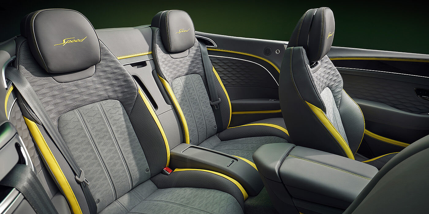 Bentley Tbilisi Bentley New Continental GTC Speed convertible rear interior with unique Speed colour split in Gravity Grey and Cyber Yellow hide colours, and contrast stitched headrest emblems 