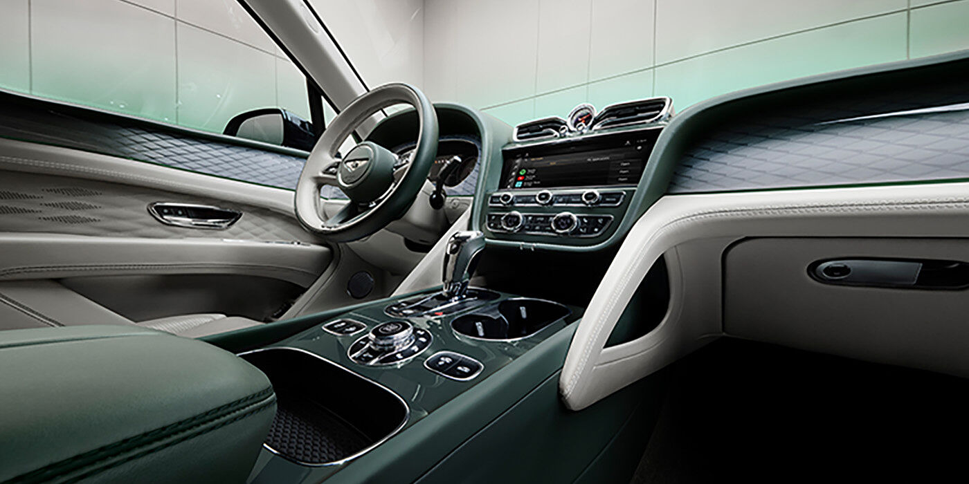 Bentley Tbilisi Bentley Bentayga Atelier Edition SUV front interior in Portland and Cumbrian Green hides with Dark Tint Diamond Brushed Aluminium veneer