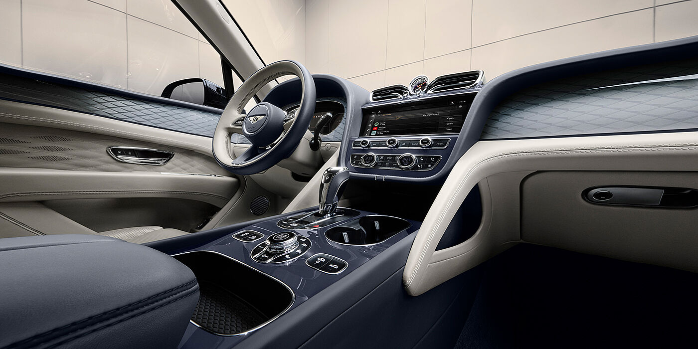 Bentley Tbilisi Bentley Bentayga Atelier Edition SUV front interior in Linen and Imperial Blue hides with Dark Tint Diamond Brushed Aluminium veneer