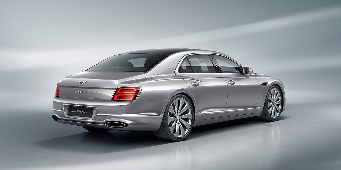 Bentley Tbilisi New Bentley Flying Spur sedan rear view in Silverlake paint with ten spoke wheels and chrome matrix grille