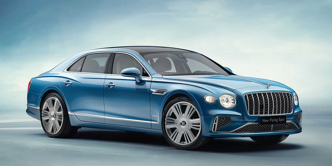 Bentley Tbilisi New Bentley Flying Spur Azure sedan front view in Light windsor blue by Mulliner paint with 22 inch Azure wheels and chrome exterior details