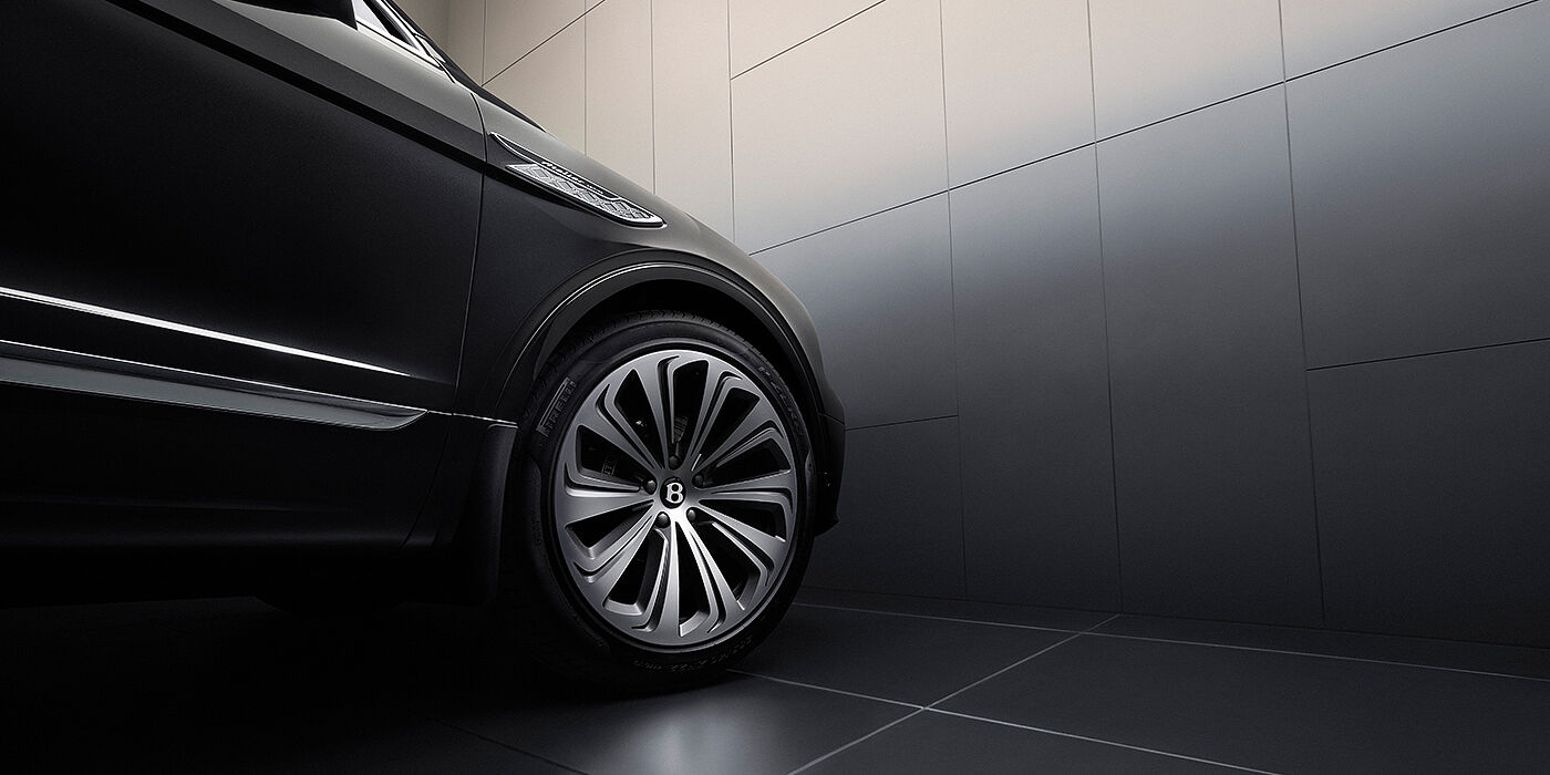 Bentley Tbilisi Bentley Bentayga Atelier Edition SUV in Onyx black paint front side detail with 22 inch 10 spoke wheel