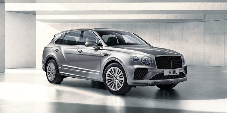 Bentley Tbilisi Bentley Bentayga Extended Wheelbase SUV front three quarter in Moonbeam paint with a grey background